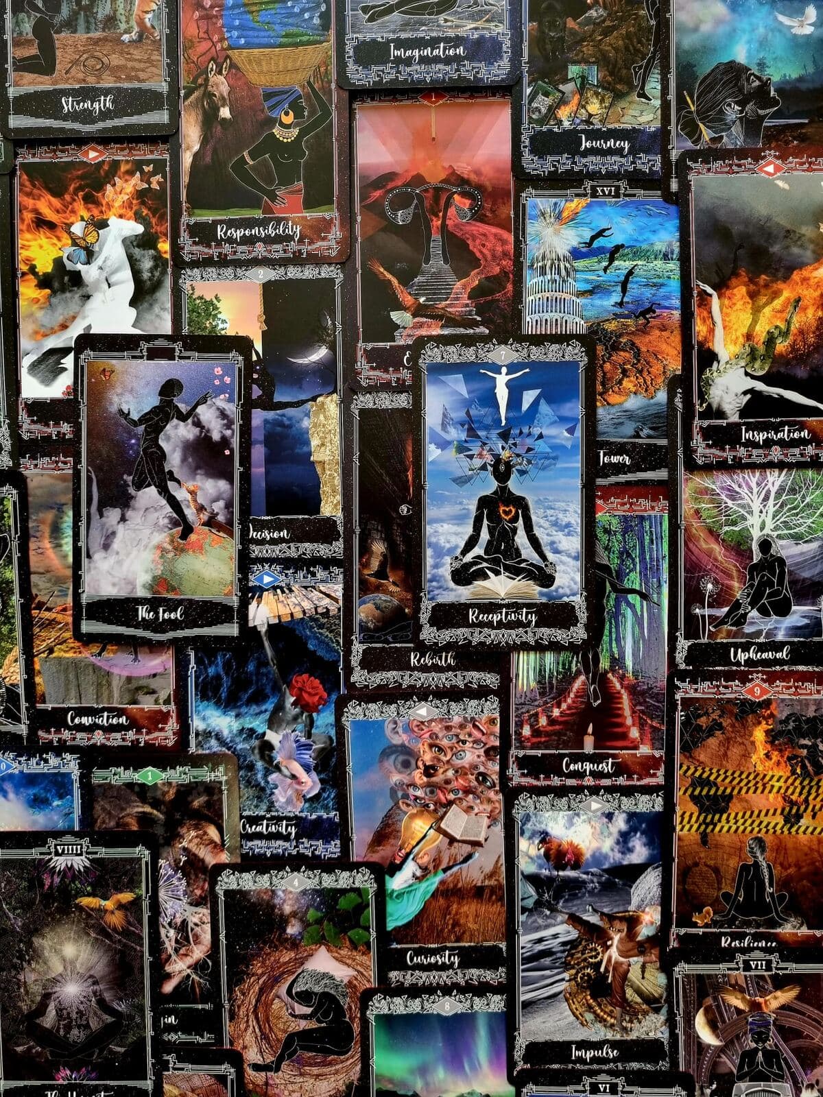 A mosaic of Cosmosis Tarot cards laid edge to edge, including Strength, Imagination, The Fool, Receptivity and Curiosity